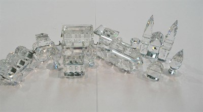 Lot 381 - Swarovski crystal train and three carriages, church with two steeples, two houses and three...