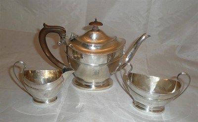 Lot 392 - A silver three piece tea service