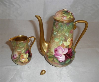 Lot 398 - A Royal Worcester porcelain coffee pot and cover and matching cream jug signed 'Twin'