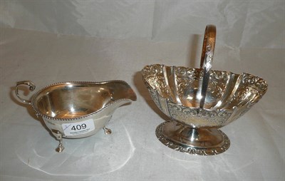 Lot 409 - Oval silver basket on pedestal stand and a silver sauce boat (2)