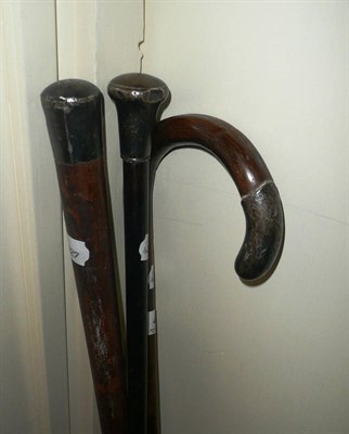 Lot 426 - Three silver-topped walking sticks