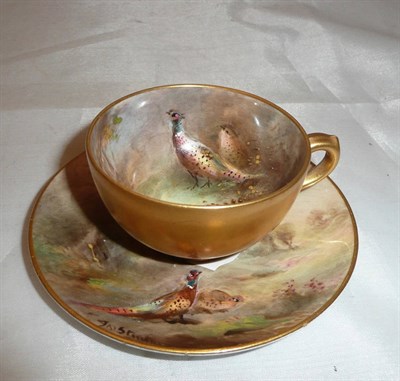 Lot 451 - Royal Worcester coffee cup and saucer decorated with pheasants by James Stinton