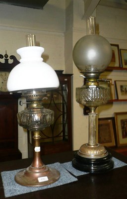 Lot 492 - Two cut glass oil lamps