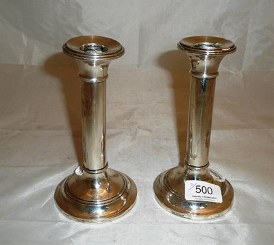 Lot 500 - Pair of loaded silver dwarf table candlesticks (cased)