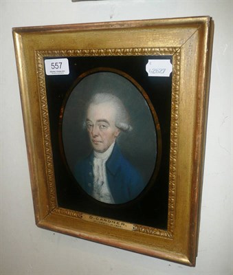 Lot 557 - Gilt-framed oval portrait of a gent in a blue coat