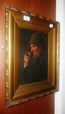 Lot 559 - Oil painting of a fisherman with pipe, follower of Walter Langley