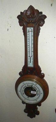 Lot 604 - A oak-cased aneroid barometer