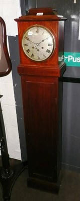 Lot 617 - A mahogany mantel clock with brass inlay by Story of Barrow on a mahogany trunk