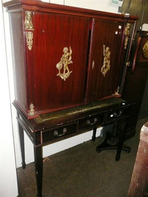 Lot 619 - An Empire style cabinet on associated stand