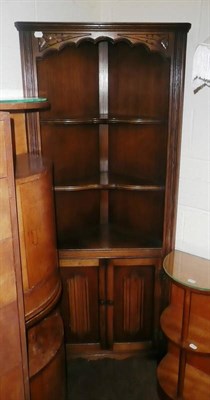 Lot 624 - A reproduction oak linen fold decorated floor standing corner unit