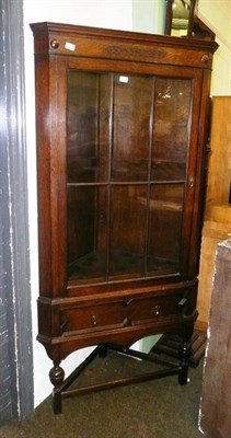 Lot 631 - Large oak-framed glazed corner cabinet on stand