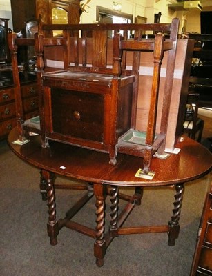 Lot 639 - An oak drop-leaf table and an oak hall bench with stick stand