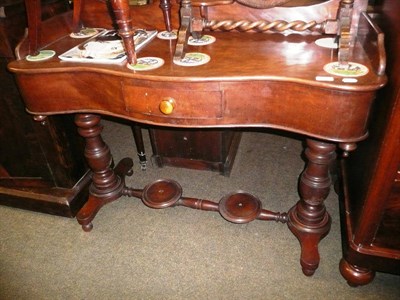 Lot 643 - A Victorian mahogany serpentine-fronted dressing table