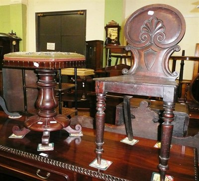 Lot 661 - A 19th century carved mahogany hall chair and a carved mahogany pedestal with a beadwork top