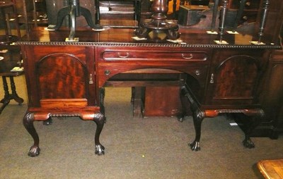 Lot 662 - A reproduction mahogany twin pedestal sideboard on cabriole legs with claw and ball feet