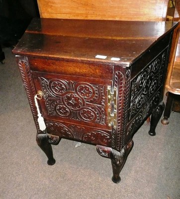 Lot 666 - Carved oak cupboard