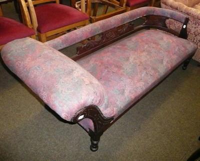 Lot 709 - A carved oak-framed chaise-longue