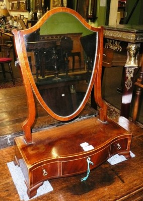 Lot 727 - A 19th century mahogany shield-shaped toilet mirror on stand