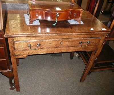 Lot 728 - A George III oak side table with foldover top and drawer