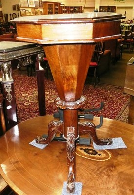 Lot 729 - A walnut work table on tripod base