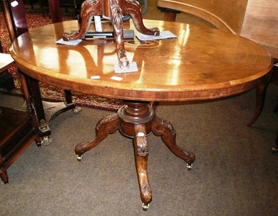 Lot 730 - A 19th century oval walnut-inlaid pedestal table