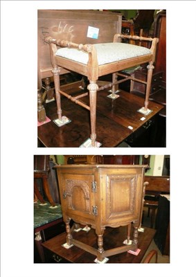 Lot 735 - A reproduction oak small cabinet and a piano seat