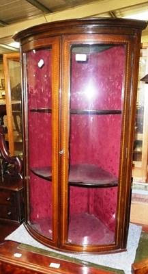 Lot 740 - A mahogany inlaid glazed corner cabinet