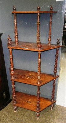 Lot 759 - A walnut inlaid four tier whatnot