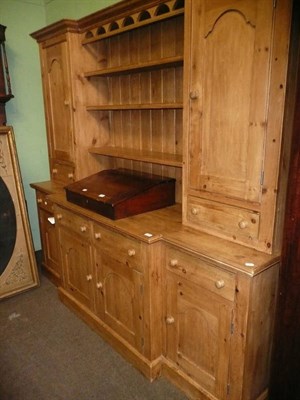 Lot 763 - A large pine break-front dresser and rack