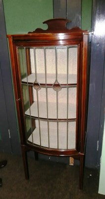 Lot 771 - A mahogany bowfront glazed display cabinet, circa 1920