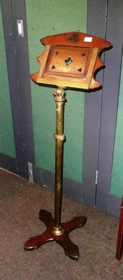 Lot 772 - A carved oak Gothic-style music stand with adjustable brass column