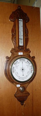 Lot 784 - An oak-framed late 19th century aneroid barometer