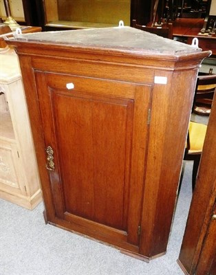 Lot 839 - A 19th century oak corner cabinet