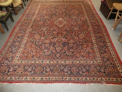 Lot 846 - Large Kashan carpet with pole medallion on navy field