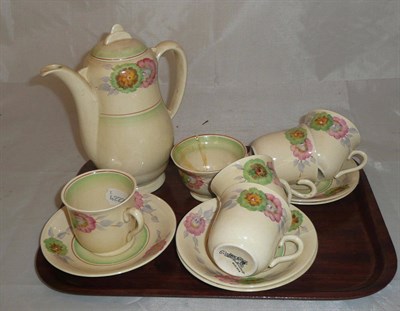 Lot 9 - A Clarice Cliff coffee set comprising of coffee pot and cover, sugar bowl, five cups and saucers