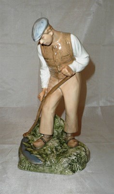 Lot 33 - B & G porcelain figure of a farmhand (restored)