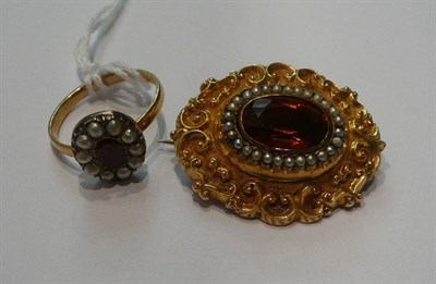 Lot 49 - A garnet and seed pearl set cluster ring and a brooch with foil backed stone centre and seed...