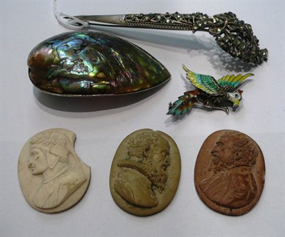 Lot 60 - A paste set dirk brooch, three cameos and an enamelled brooch and shell brooch