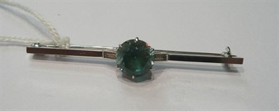 Lot 62 - A blue zircon and diamond bar brooch
