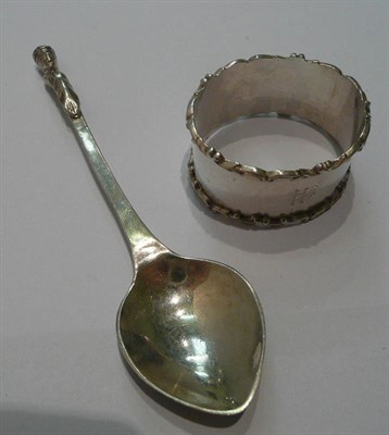 Lot 65 - A E Jones silver spoon and silver napkin ring