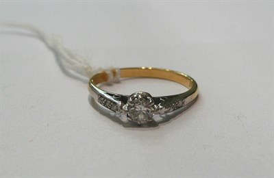 Lot 66 - A diamond solitaire ring with diamond set shoulders