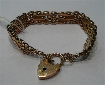 Lot 82 - A gate bracelet stamped '9ct'