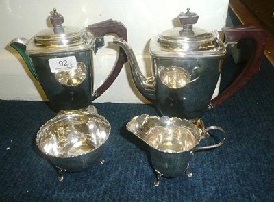 Lot 92 - A silver coffee pot, hot water jug, milk jug and a sugar bowl, 32oz