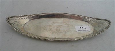 Lot 115 - A Georgian oval pierced silver pen tray with armorial crest
