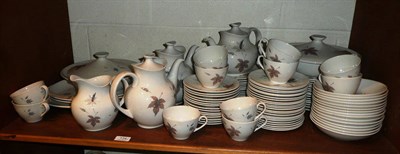 Lot 134 - Royal Doulton 'Tumbling Leaves' dinner, tea and coffee service on two shelves