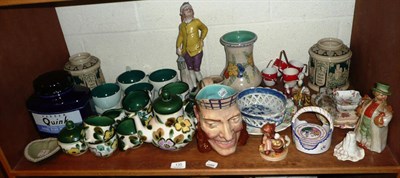 Lot 135 - Shelf of decorative ceramics including tea wares, character jugs, Gouda vase, Goebels figure, a...