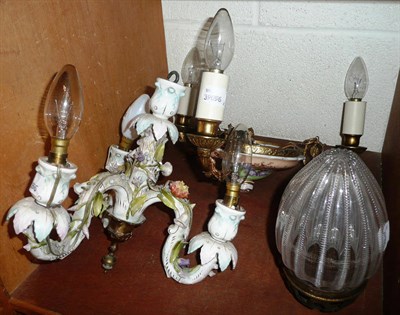 Lot 143 - Two small porcelain and gilt metal chandeliers and a cut glass acorn hanging light