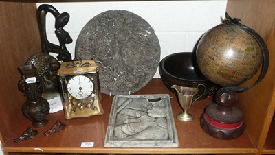 Lot 155 - Shelf of ornamental items including an African Bronze, plaque mask, table globe, four hundred...