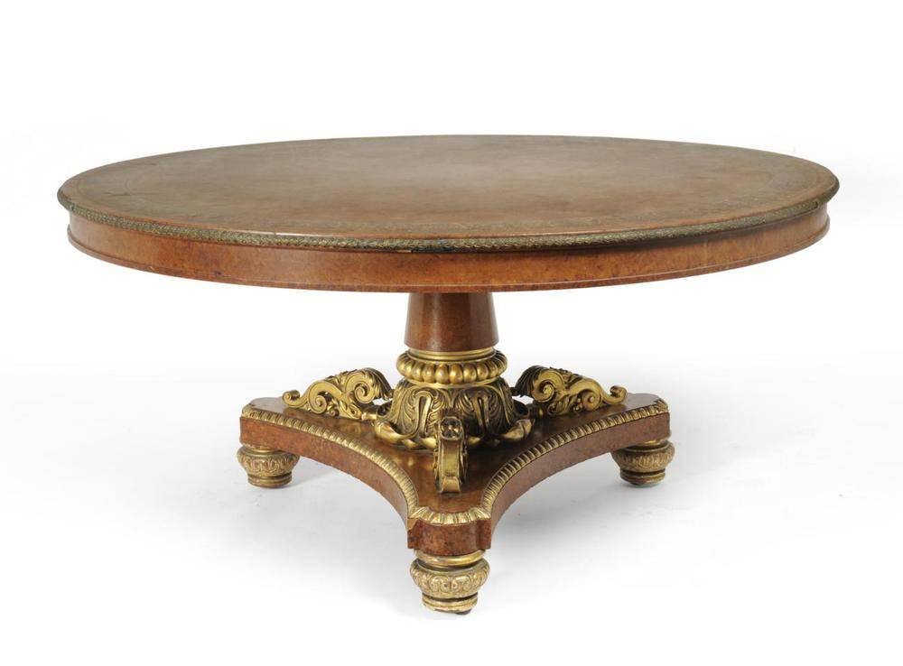 Lot 1180 - A George IV Amboyna, Purplewood, Marquetry and Parcel Gilt Circular Dining Table, in the manner...