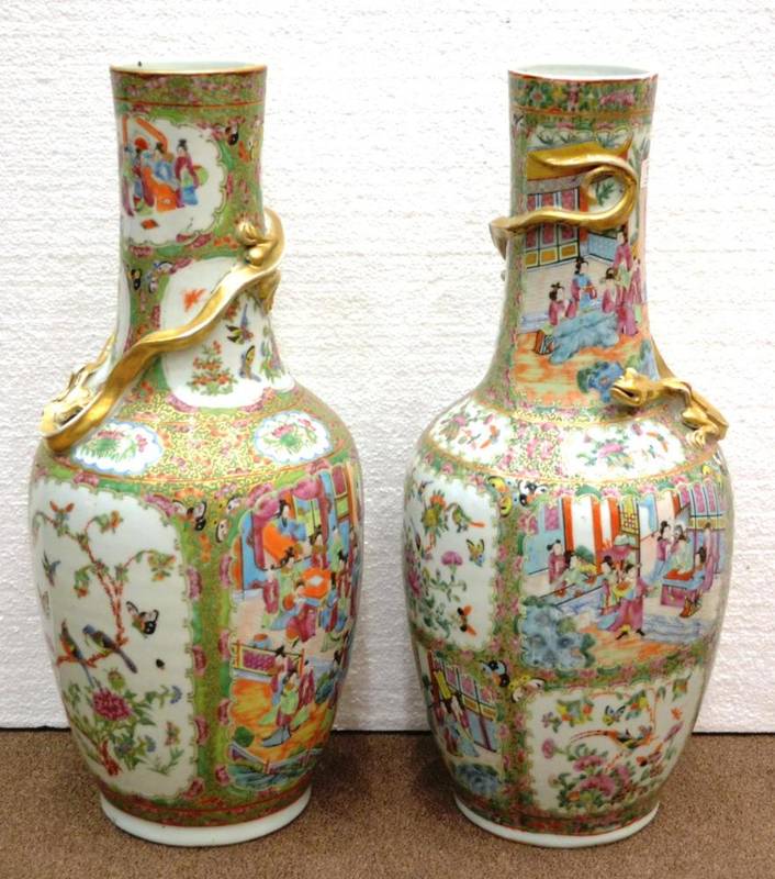 Lot 68 - A Matched Pair of Cantonese Porcelain Large Bottle Vases, mid 19th century, the cylindrical...
